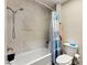 This remodeled shower is complete with marble tile and updated shower head at 2851 S Valley View Blvd # 1071, Las Vegas, NV 89102