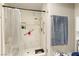 This remodeled shower is complete with marble tile, grab bars, and updated shower head at 2851 S Valley View Blvd # 1071, Las Vegas, NV 89102