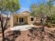 Cozy backyard with a covered patio, mature trees, and shaded area at 3053 Monroe Park Rd, Henderson, NV 89052