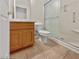 Bathroom with a tile floor, oak vanity, and glass shower at 3053 Monroe Park Rd, Henderson, NV 89052