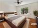 Comfortable bedroom featuring a king-sized bed, hardwood flooring, and lots of natural light at 3053 Monroe Park Rd, Henderson, NV 89052