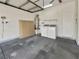 Garage featuring a washer, dryer, water heater, and ample space for parking and storage at 3053 Monroe Park Rd, Henderson, NV 89052