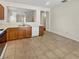 A view of the kitchen featuring tile floors and wood cabinets at 3053 Monroe Park Rd, Henderson, NV 89052