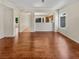 Open living room featuring hardwood floors with views into the kitchen at 3053 Monroe Park Rd, Henderson, NV 89052