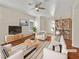 Bright living room features a ceiling fan, hardwood floors, and modern furnishings at 3053 Monroe Park Rd, Henderson, NV 89052