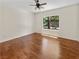Bedroom with hardwood flooring and a window offering views of the backyard landscaping at 3053 Monroe Park Rd, Henderson, NV 89052