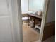 Small half bathroom with tile flooring, toilet, and rustic vanity with open storage underneath at 3447 One Nation Ave, Las Vegas, NV 89121