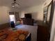 Spacious bedroom featuring a ceiling fan, large bed and natural light from the window at 3447 One Nation Ave, Las Vegas, NV 89121