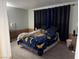 View of a cozy bedroom featuring unique decor and comfortable sleeping arrangements at 3447 One Nation Ave, Las Vegas, NV 89121