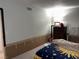 Bedroom with personal touches, including a cozy bed and functional furniture at 3447 One Nation Ave, Las Vegas, NV 89121