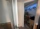 Walk-in closet featuring rod and shelf storage filled with boxes and personal items at 3447 One Nation Ave, Las Vegas, NV 89121