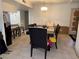 View of a dining room connected to kitchen, and a simple chandelier at 3447 One Nation Ave, Las Vegas, NV 89121