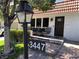 Inviting front exterior with brick walkway, cozy porch seating, and a well-manicured lawn with number placard at 3447 One Nation Ave, Las Vegas, NV 89121
