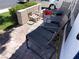 Inviting front porch features comfortable seating, a brick walkway, and a glimpse of the manicured lawn at 3447 One Nation Ave, Las Vegas, NV 89121