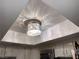 Close up of a kitchen light with an intricate, wire-style design, adding a touch of modern elegance at 3447 One Nation Ave, Las Vegas, NV 89121