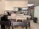Eat-in kitchen with updated stainless steel appliances and barstool seating at 3447 One Nation Ave, Las Vegas, NV 89121