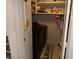 Laundry closet featuring a washer and dryer and shelving with cleaning supplies at 3447 One Nation Ave, Las Vegas, NV 89121