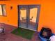 A covered patio, offering a cozy outdoor space with access from the interior of the home at 3447 One Nation Ave, Las Vegas, NV 89121