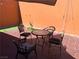 Charming outdoor patio furnished with a dining table and chairs for relaxed entertaining and dining at 3447 One Nation Ave, Las Vegas, NV 89121