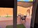 View of the furnished patio from inside, featuring comfortable seating and shade for relaxation at 3447 One Nation Ave, Las Vegas, NV 89121