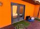 Glass paneled patio door with turf mat and outdoor seating at 3447 One Nation Ave, Las Vegas, NV 89121