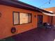 Enclosed patio area with tiled flooring, shade covering and a large window at 3447 One Nation Ave, Las Vegas, NV 89121