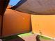 Private patio space with string lights, shade covering, and low-maintenance artificial turf at 3447 One Nation Ave, Las Vegas, NV 89121