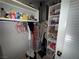 Utility closet featuring water heater and shelving filled with cleaning supplies and personal items at 3447 One Nation Ave, Las Vegas, NV 89121