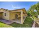 A lovely covered patio and green yard offer a relaxing outdoor space at 3557 Wayne Cir, Las Vegas, NV 89121