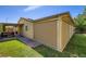 Secluded backyard featuring green grass and a covered patio that extends the living space at 3557 Wayne Cir, Las Vegas, NV 89121
