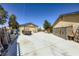 Expansive concrete driveway with detached garage and backyard storage providing lots of space at 3557 Wayne Cir, Las Vegas, NV 89121