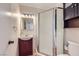 This bathroom features a vanity with stylish sink and shower with unique glass doors at 3557 Wayne Cir, Las Vegas, NV 89121