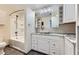 Bright bathroom featuring a sink, vanity, modern mirror and a shower-tub combination at 3557 Wayne Cir, Las Vegas, NV 89121