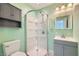 This bathroom features a gray vanity and a glass shower at 3557 Wayne Cir, Las Vegas, NV 89121