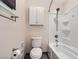 Bathroom featuring a shower-tub combination, toilet, and an overhead cabinet for storage at 3557 Wayne Cir, Las Vegas, NV 89121