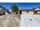 Charming single-story home with an expansive driveway and well-maintained landscaping at 3557 Wayne Cir, Las Vegas, NV 89121