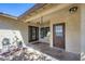 Welcoming front entrance with brown doors, a hanging basket, and exterior lighting at 3557 Wayne Cir, Las Vegas, NV 89121