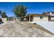 Charming single-story home featuring xeriscaping, a gated entrance, and a well-maintained lawn at 3557 Wayne Cir, Las Vegas, NV 89121