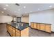 Spacious kitchen featuring granite countertops, wooden cabinetry, and stainless-steel appliances at 3557 Wayne Cir, Las Vegas, NV 89121