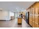 Open-concept kitchen and living area, featuring a modern island, black appliances, and plenty of cabinets at 3557 Wayne Cir, Las Vegas, NV 89121