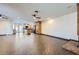 An open living room with wood tile floors, recessed lighting, and direct access to the kitchen at 3557 Wayne Cir, Las Vegas, NV 89121