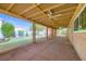 Large covered patio featuring outdoor curtains, a ceiling fan, and views of the backyard at 3557 Wayne Cir, Las Vegas, NV 89121