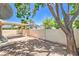 Backyard featuring gravel and concrete patio with mature trees for shade at 3640 Shanagolden St, Las Vegas, NV 89129