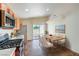 Eat-in kitchen with stainless steel appliances, tile flooring, and sliding door access to the outside at 3640 Shanagolden St, Las Vegas, NV 89129