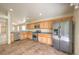 A kitchen featuring stainless steel appliances and granite countertops with wood cabinets at 3640 Shanagolden St, Las Vegas, NV 89129