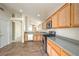 A kitchen with stainless steel appliances and granite countertops with view into the dining area at 3640 Shanagolden St, Las Vegas, NV 89129