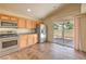 An eat-in kitchen featuring stainless steel appliances and backyard access through sliding glass door at 3640 Shanagolden St, Las Vegas, NV 89129