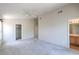 A main bedroom featuring an ensuite bath, ceiling fan and walk in closet for storage at 3640 Shanagolden St, Las Vegas, NV 89129
