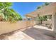 Covered patio featuring a ceiling fan and landscaped yard perfect for outdoor relaxation and entertaining at 3640 Shanagolden St, Las Vegas, NV 89129