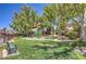 Community playground with slides, picnic tables, and lush greenery perfect for families at 3640 Shanagolden St, Las Vegas, NV 89129